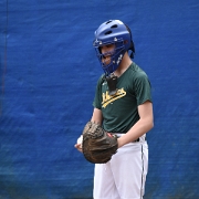 Catching the first pitch Johnny DeCampos of the PJF Athletics